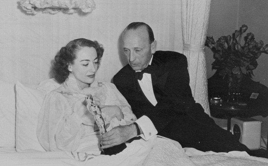 Joan Crawford accepting her Academy Award from her bed 