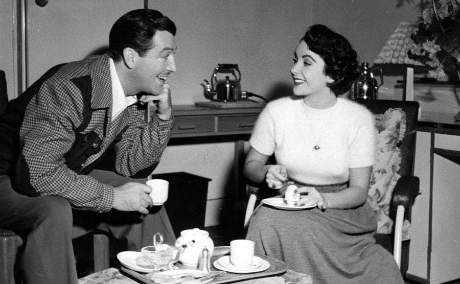 Elizabeth Taylor with her husband Robert having tea at home 