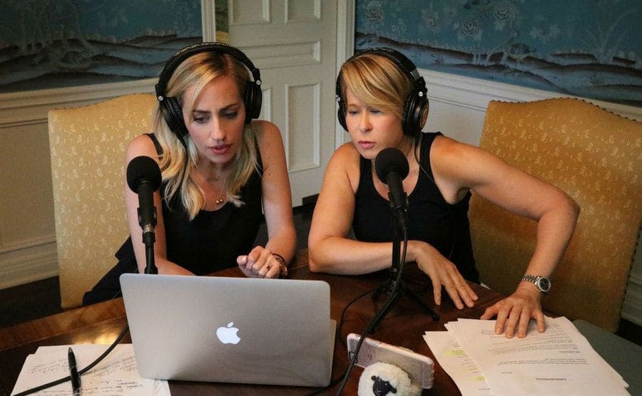 Yeardley Smith and Zibby Allen are doing a podcast at a dining room table. 