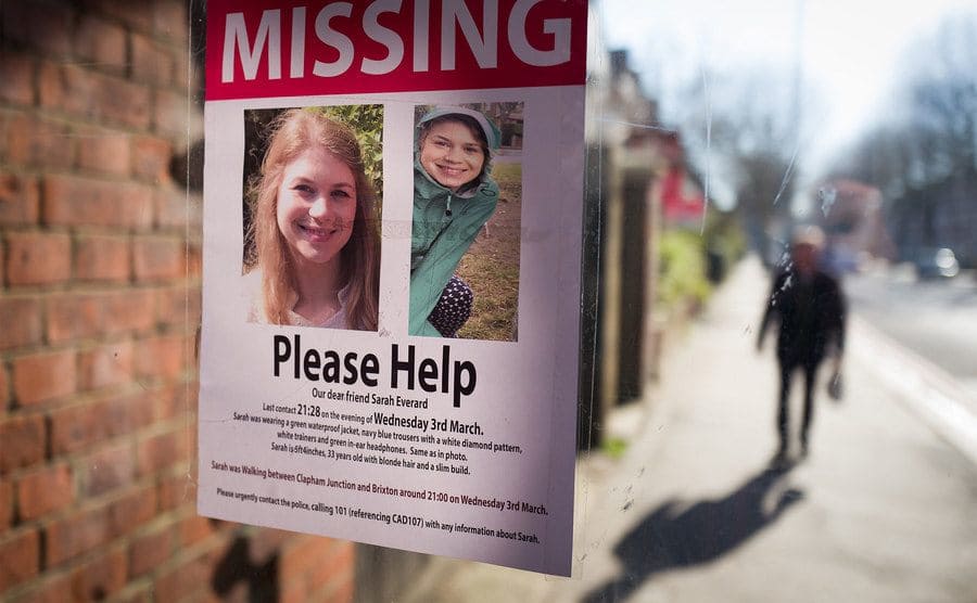 A flyer of a missing girl placed in a store window. 