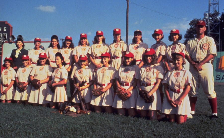 The cast of “A League of Their Own” posing for a team picture. 