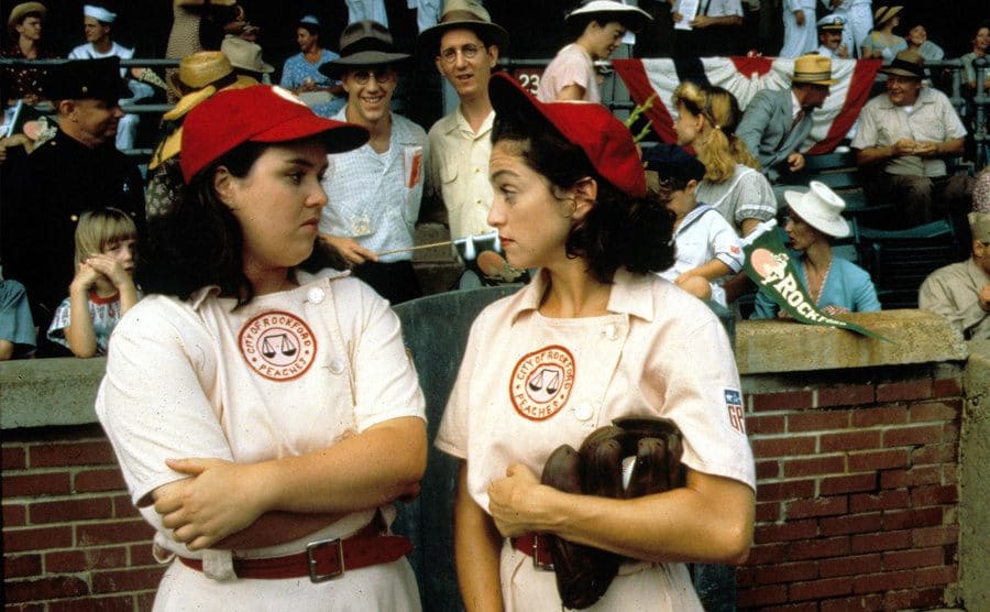 Rosie O’Donnell is talking to Madonna during a game in a scene from ‘A League of Their Own’. 