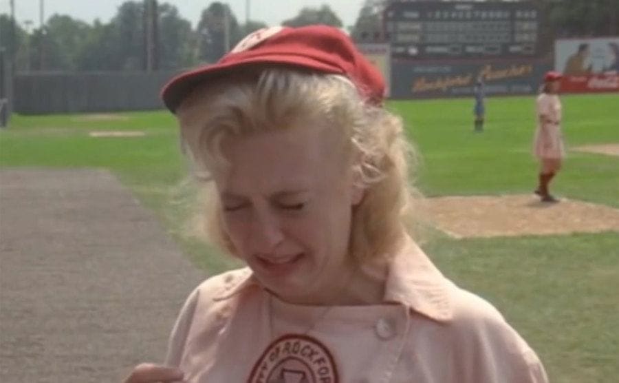 Bitty Schram, as Evelyn Gardner crying on the field during a game. 