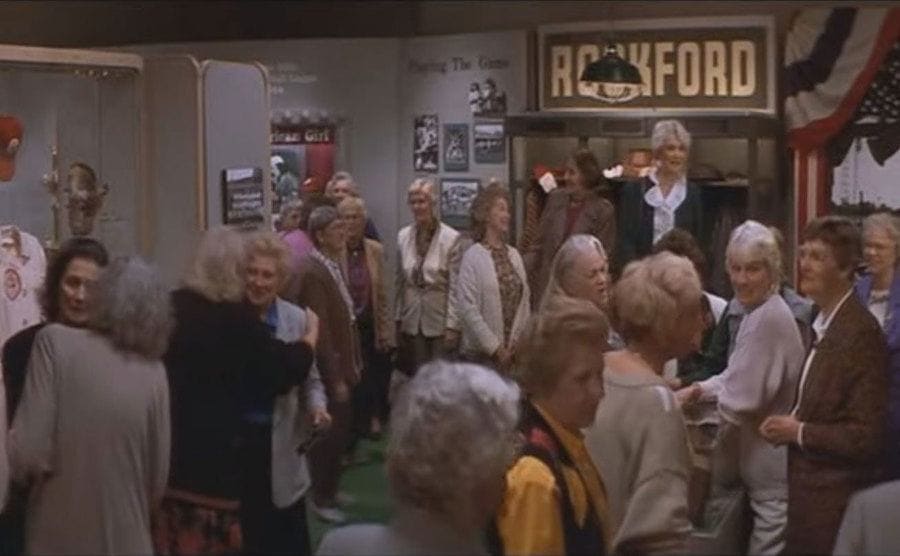 The extras walking around the hall of fame exhibit in the opening scene of ‘A League of Their Own’. 