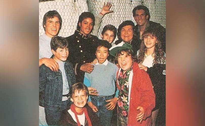 Michael Jackson takes a group photo with the cast of The Goonies