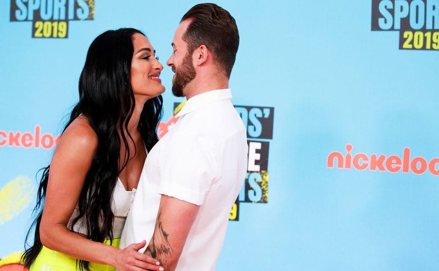 Nikki Bella and Artem Chigvintsev attend the Nickelodeon Kids' Choice Sports.