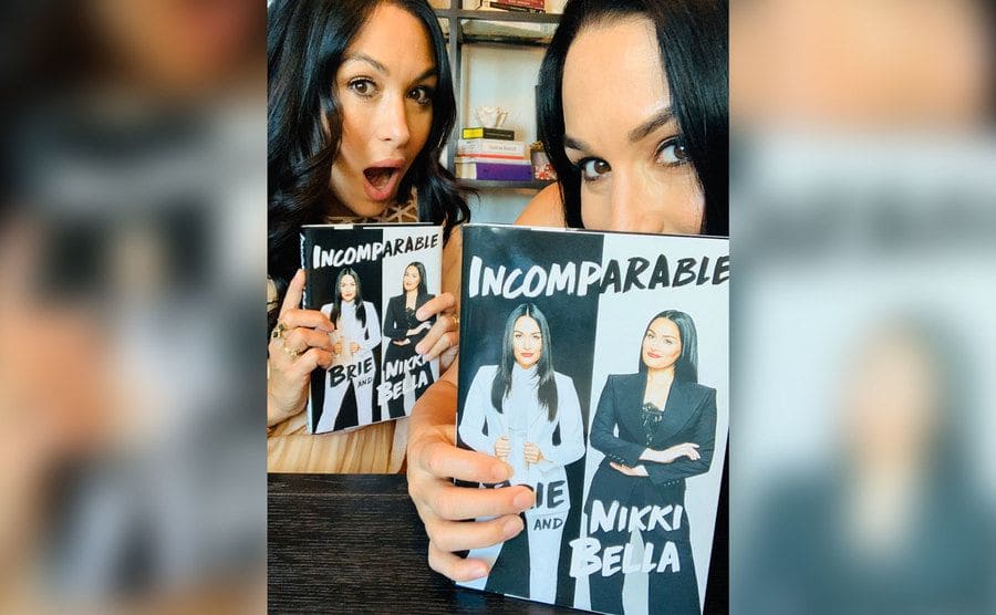 The Bella Twins showing off their book ‘Incomparable’.