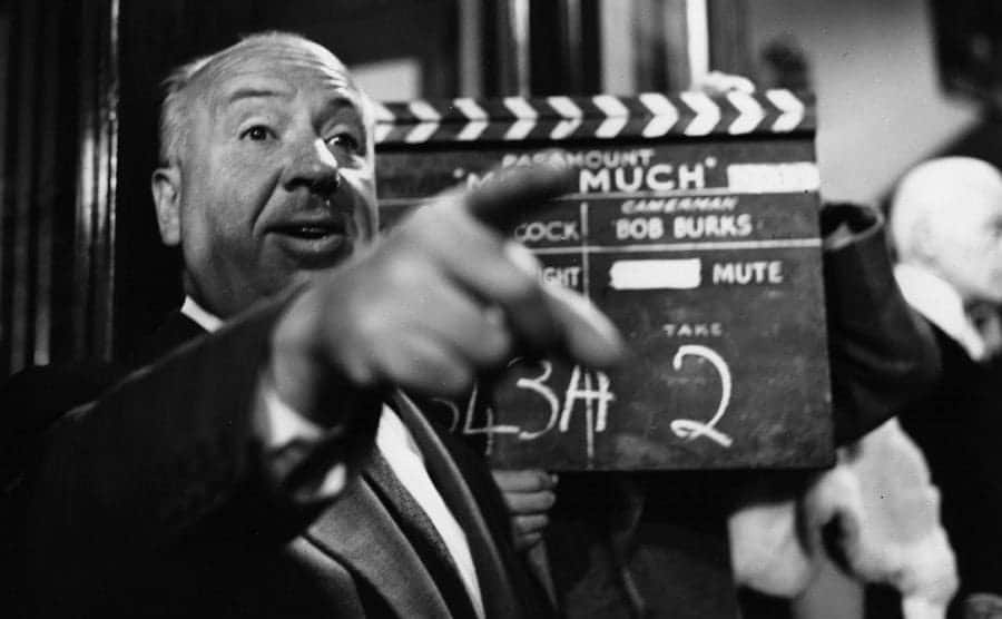 Hitchcock gives direction while filming on set. 