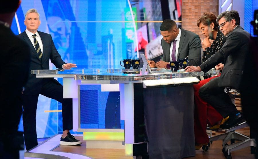 Robin Roberts, Michael Strahan, George Stephanopoulos, and Sam Champion are seen on the set of Good Morning America.