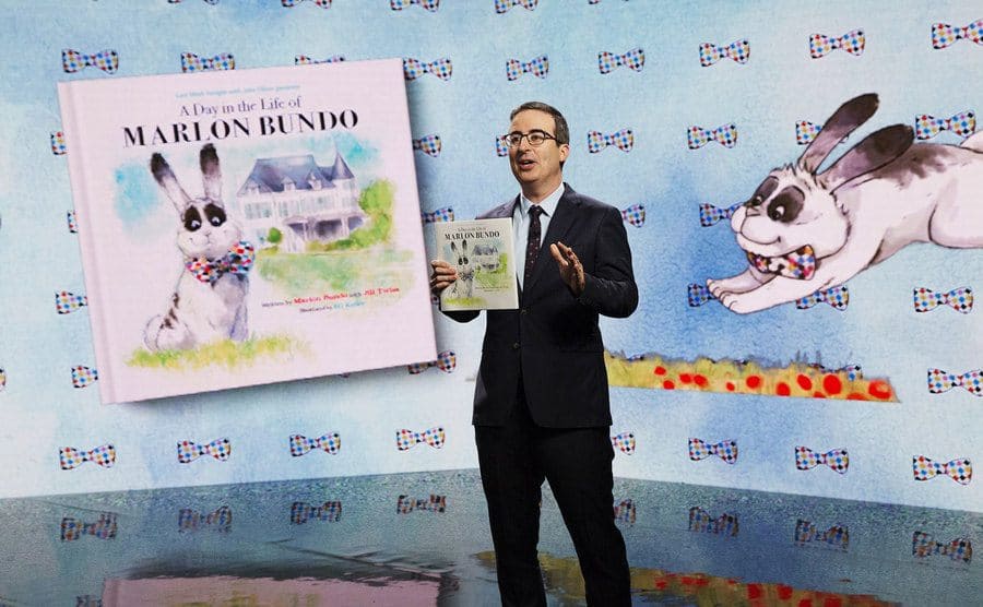John Oliver is doing a skit about his spoof of the ‘Marlon Bundo’ book. 