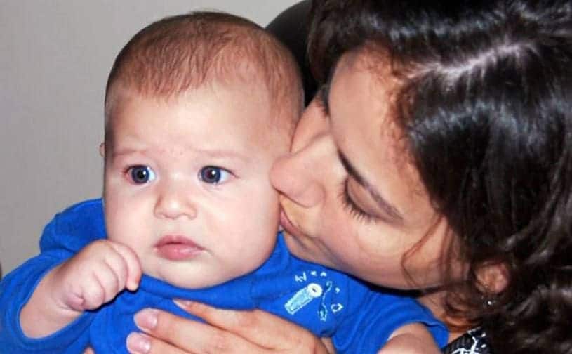 Memory of Vashti holding and kissing her baby boy.
