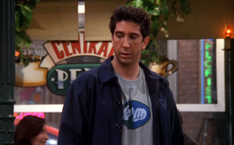 Ross wears a shirt with a drawing of a ASL sign. 