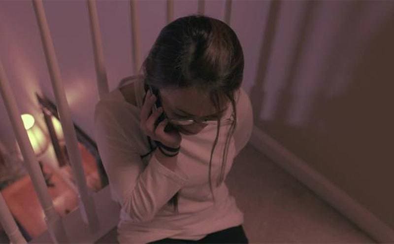A reenactment of a tired-up Jennifer calling 911. 