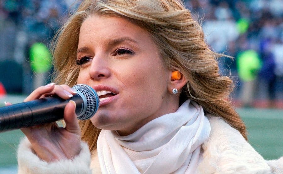 Jessica Simpson is performing The National Anthem at NFC Championship Playoff Game, circa 2003.