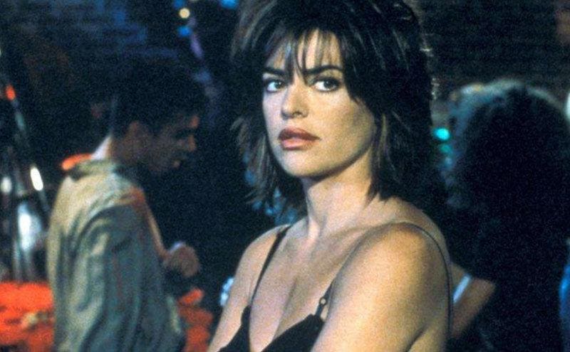Lisa Rinna as Taylor McBride standing at the bar in a still from the tv show.