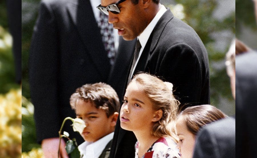 O.J. Simpson attends with his children to the funeral of their slain mother.