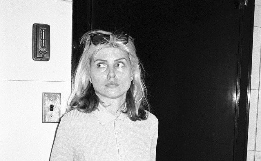 Debbie Harry has a look of worry on her face. 