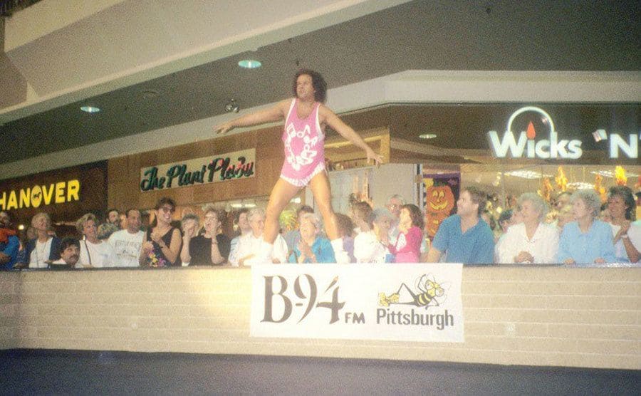 Richard Simmons performs exercise demonstrations at the mall.
