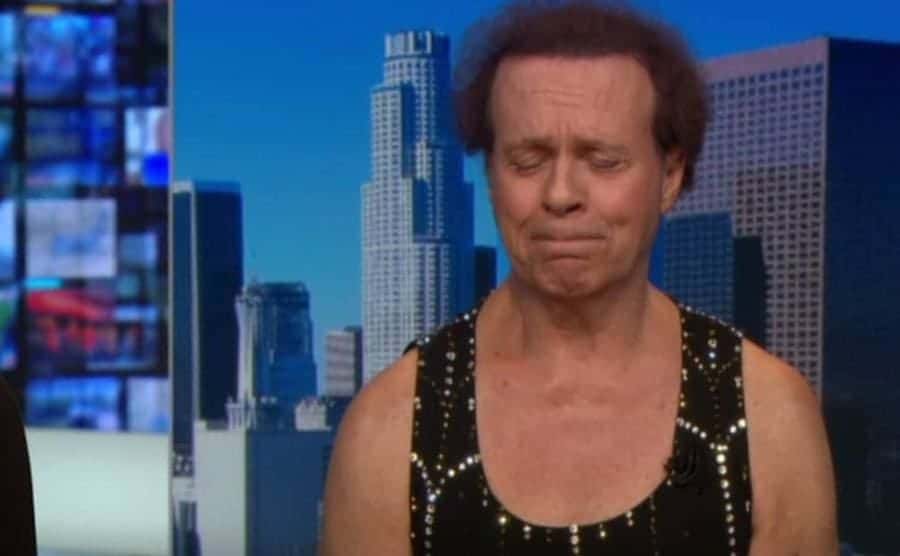 A still from Richard Simmons crying on CNN.