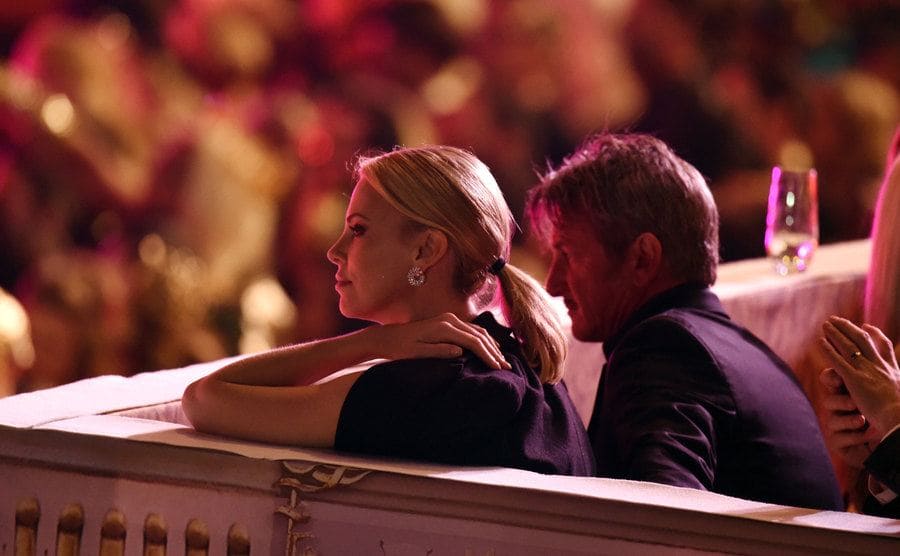 Charlize Theron and Sean Penn watch the Life Ball Show. 
