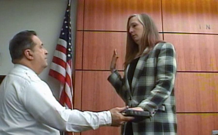 Stacey Castor takes an oath at court.