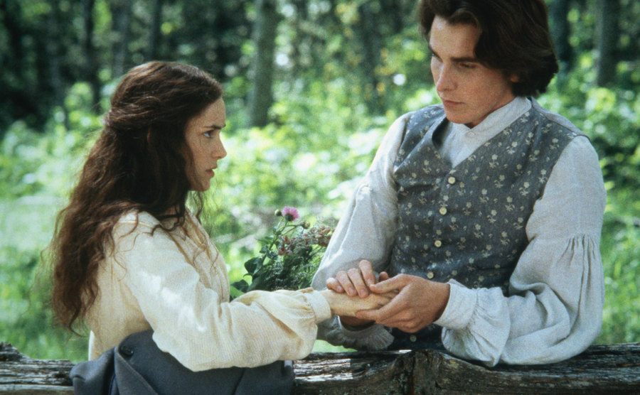 Winona Ryder is holding hands with Christian Bale in Little Women.