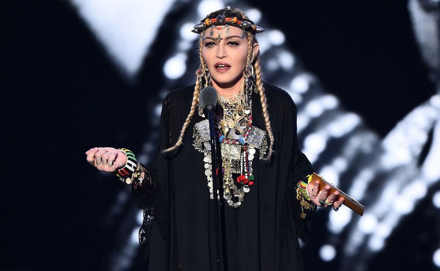 Madonna speaks on stage.