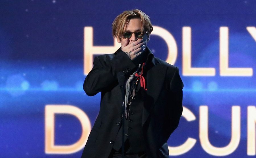 Johnny Depp speaks on stage.