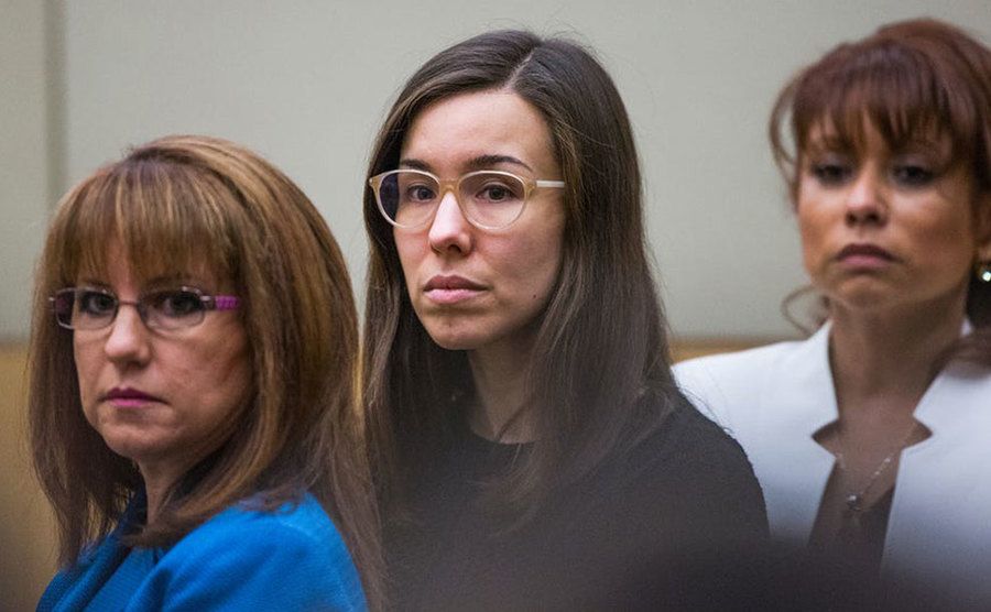 Jodi Arias stands in court, waiting for the verdict.