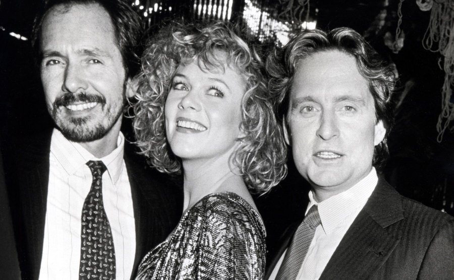 Lewis Teague, Kathleen Turner, and Michael Douglas at an event.