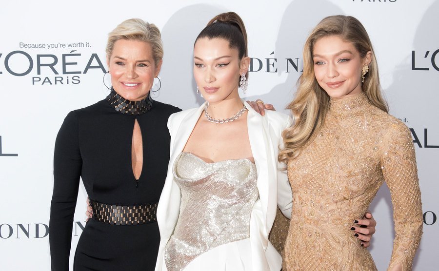 Yolanda Hadid, Bella Hadid, and Gigi Hadid attend an event.