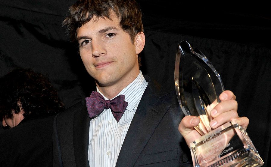 Ashton Kutcher poses backstage during the People's Choice Awards. 