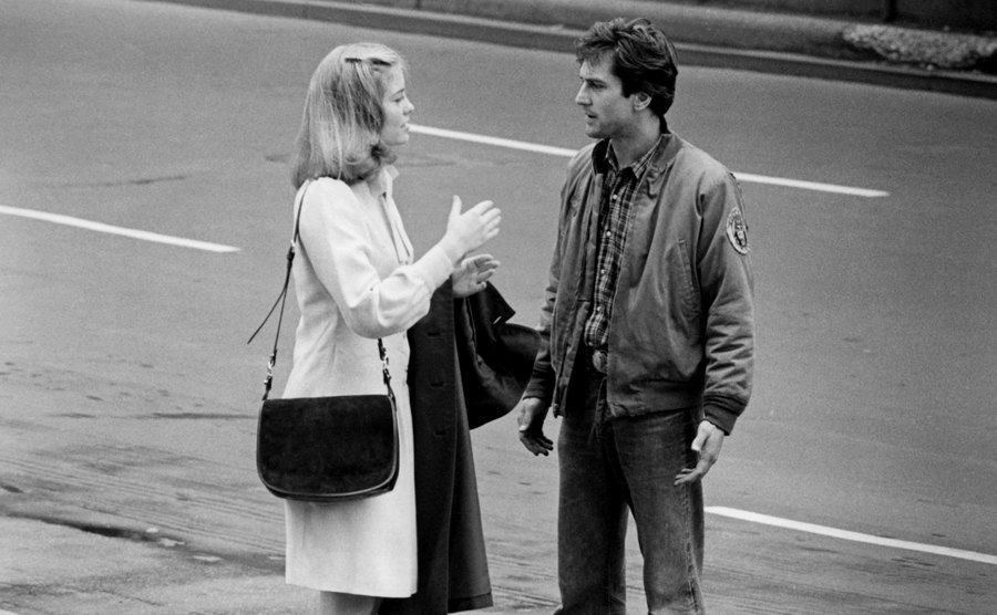 Robert De Niro as Travis Bickle and Cybill Shepherd as Betsy in Taxi Driver.'
