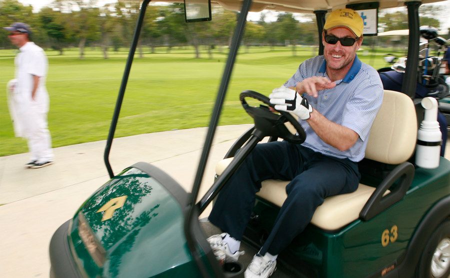 McGinley rides in a golf cart. 