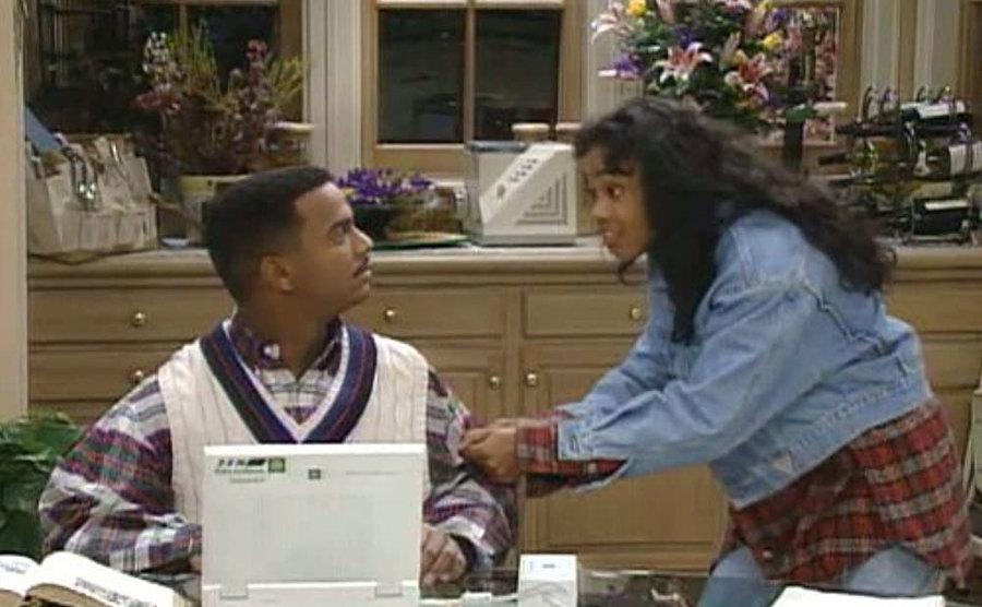 Carlton gets pulled away from his laptop by Ashley. 