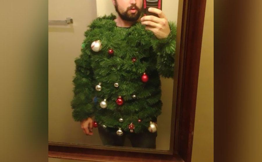 A sweater that looks like a Christmas tree; it even has ornaments on it. 