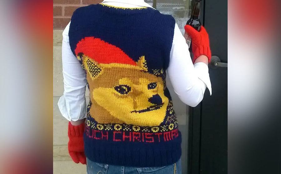 A sweater with a dog meme on the back. 
