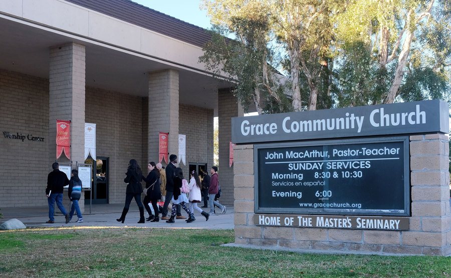 Churchgoers enter the Grace Community Church. 