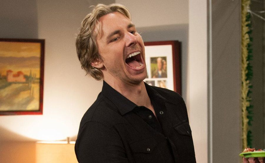 Dax Shepard laughs on set.
