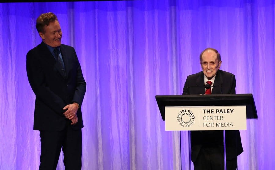 Conan O'Brien and Bob Newhart appear on stage.
