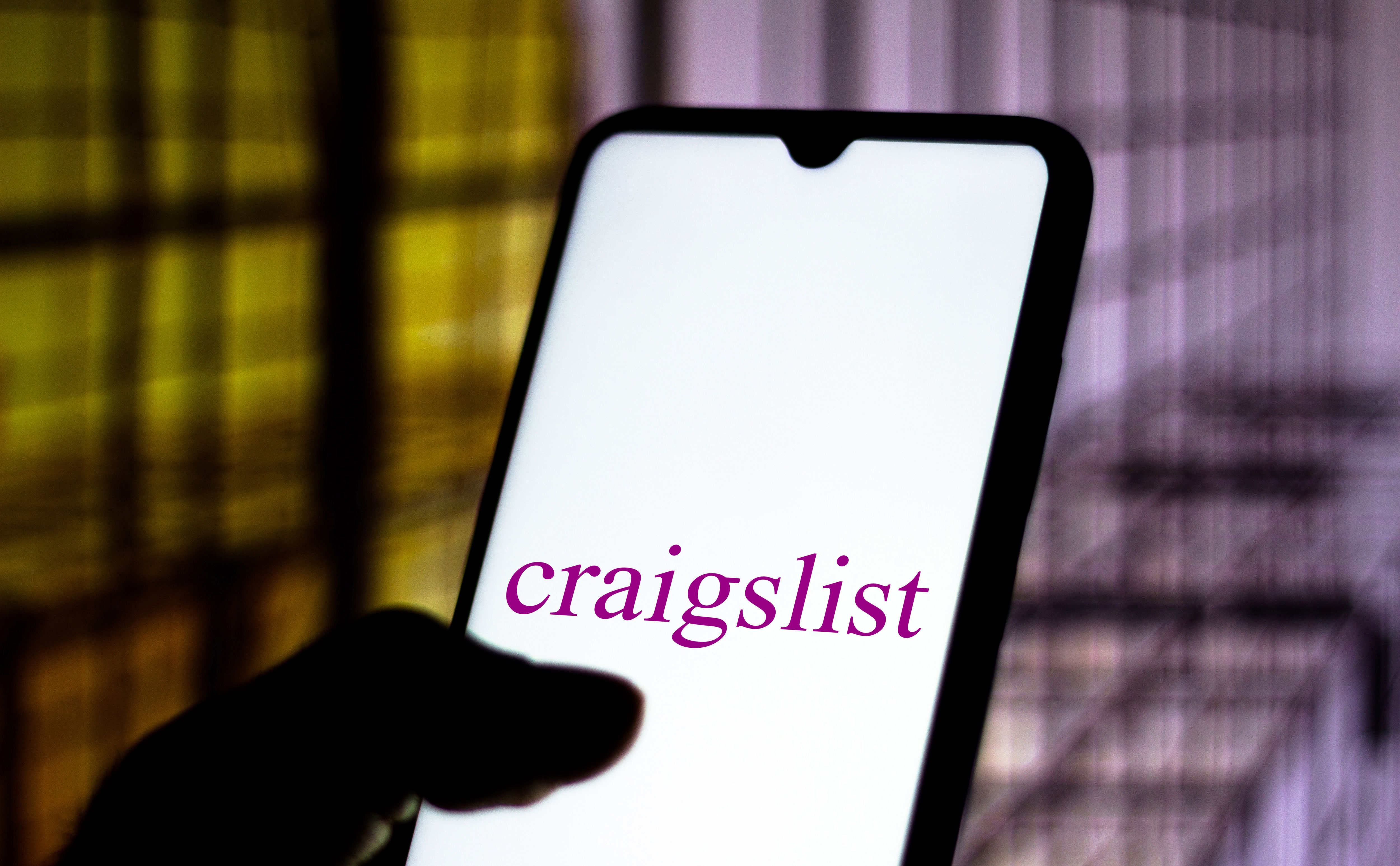 An image of the Craigslist logo displayed on a smartphone.