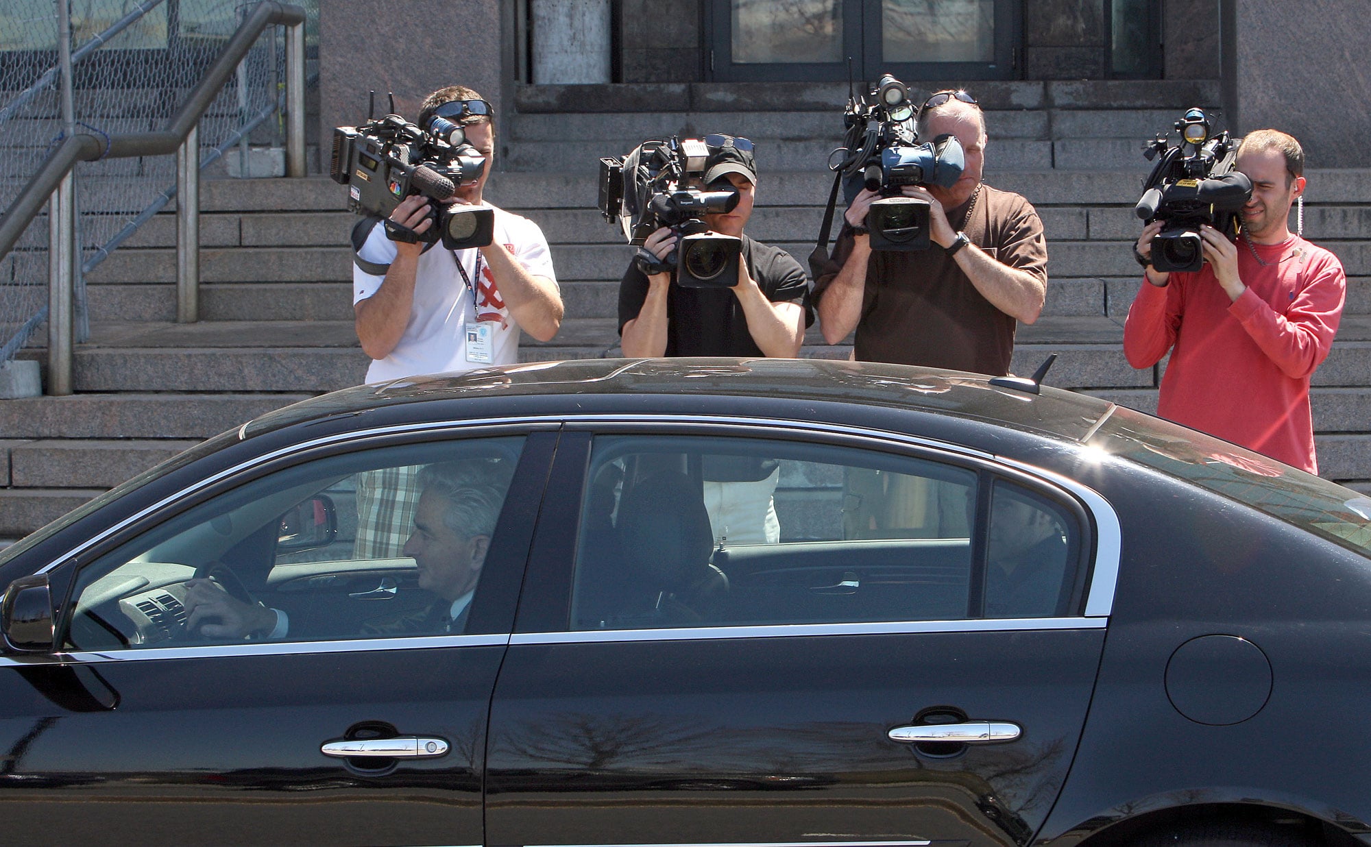The media follows Philip’s brother as he drives his car.