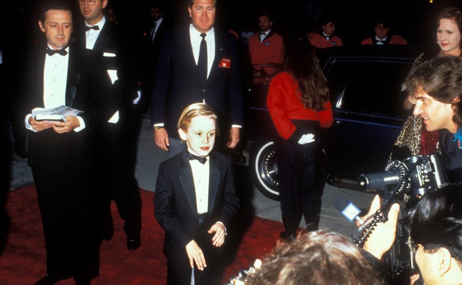 Macauley Culkin and his father attend an event.