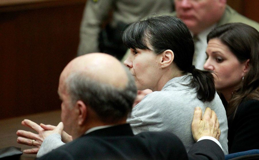 Stephanie Lazarus' attorney tried to comfort her while sitting in court. 