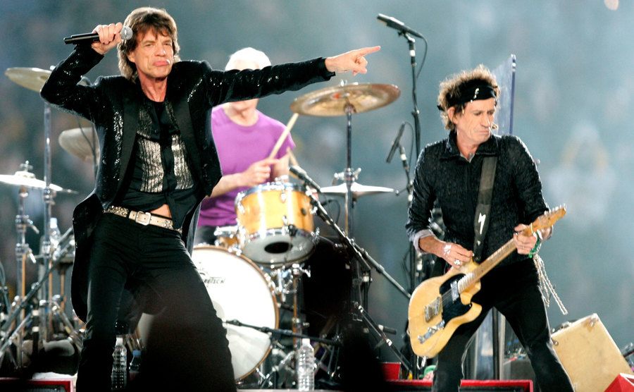 Mick Jagger, Charlie Watts, and Keith Richards of The Rolling Stones perform at Super Bowl XL. 