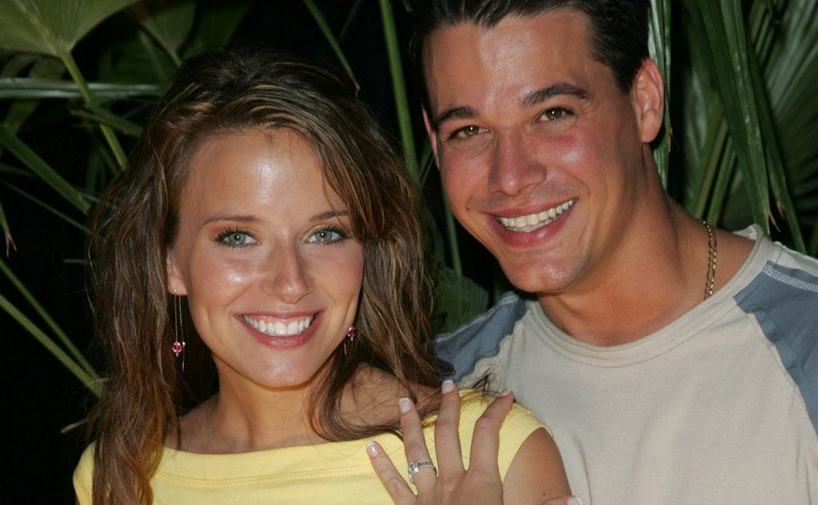 Rob Mariano and Amber Brkich are showing her engagement ring.
