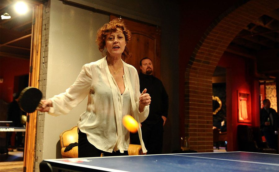 Susan Sarandon plays ping pong. 