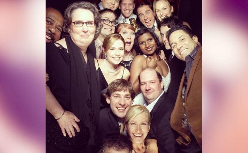 The cast members take a picture together.