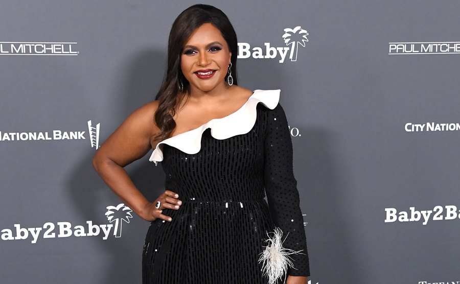 Mindy Kaling poses for the media.