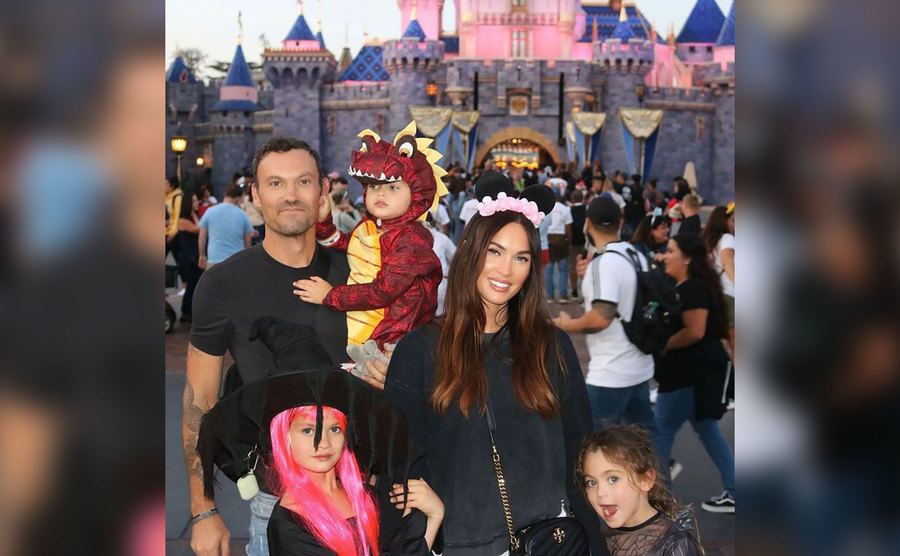 Fox and Green with their family pose for a photo at Disneyworld.